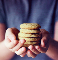 Cookies stacked in a hand.