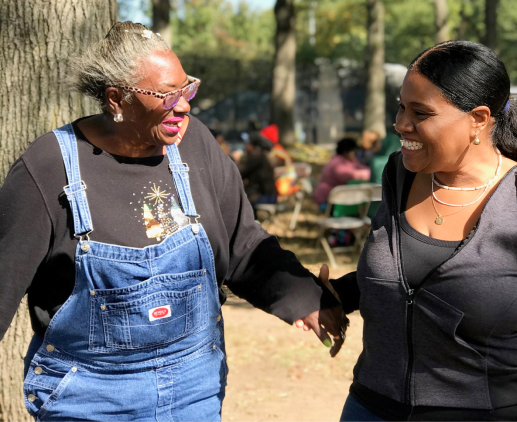 Young woman lends a helping hand to older woman